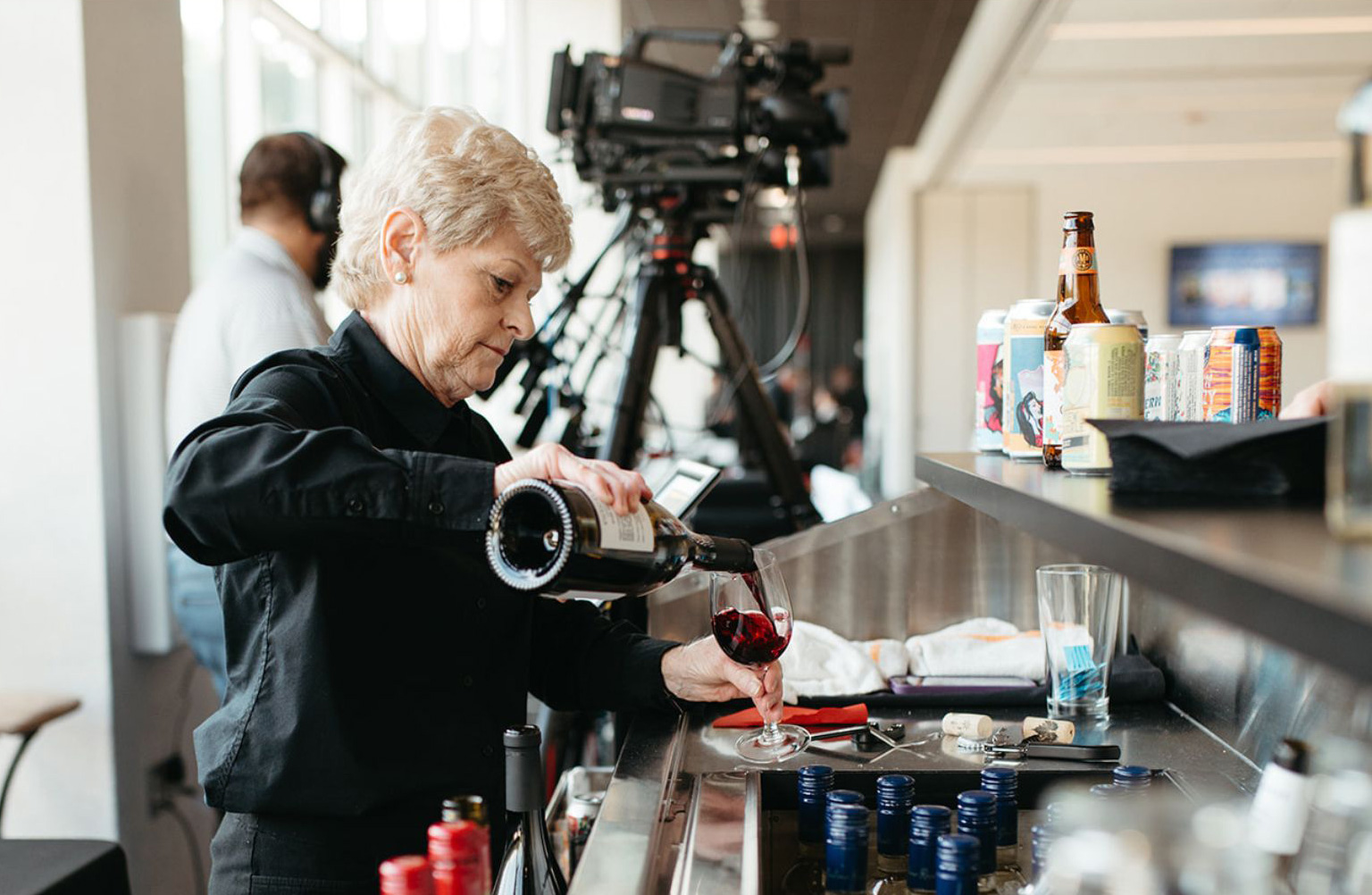 Bartender serving wine